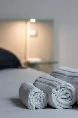 Letto o letti in una camera di Smeraldo Suite - Smart Holiday