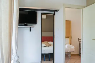 Letto o letti in una camera di TIMO - Villa Luisa: con vasca idromassaggio privata