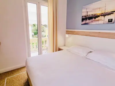 Letto o letti in una camera di Hotel Canali, Portofino Coast