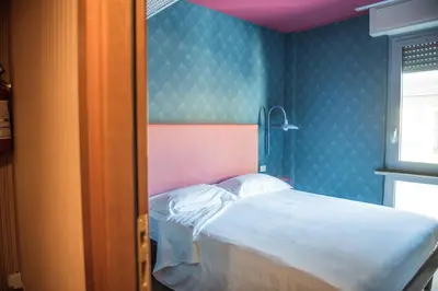 Letto o letti in una camera di Hotel Torino