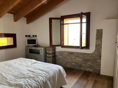 Letto o letti in una camera di Antico Borgo le Roste