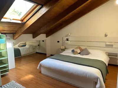 Letto o letti in una camera di Sky Attic a Reggio Emilia