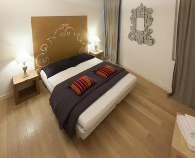 Letto o letti in una camera di Parmigianino Nove