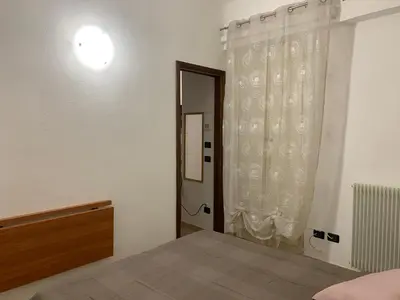 Letto o letti in una camera di A Casa di Alice Str. M. D'azeglio