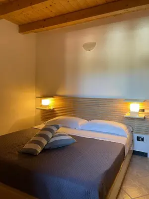Letto o letti in una camera di Archi di sole - Appartamenti