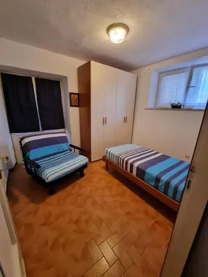 Letto o letti in una camera di CASA GAIA - Limoncello - parcheggio privato incluso