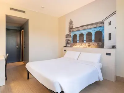 Letto o letti in una camera di B&B HOTEL Mantova