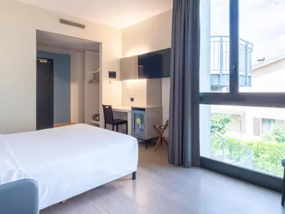 Letto o letti in una camera di B&B HOTEL Mantova