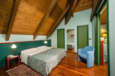 Letto o letti in una camera di Hotel & Loisir Le Ruote