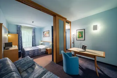 Letto o letti in una camera di Hotel & Loisir Le Ruote