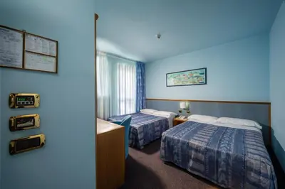 Letto o letti in una camera di Hotel & Loisir Le Ruote