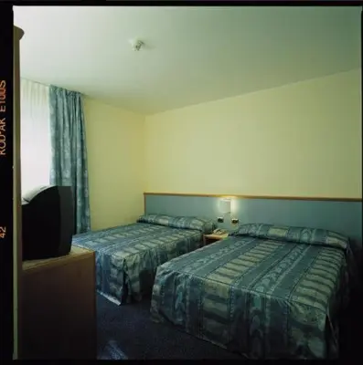 Letto o letti in una camera di Hotel & Loisir Le Ruote