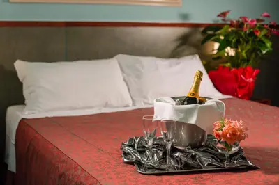 Letto o letti in una camera di Hotel & Loisir Le Ruote