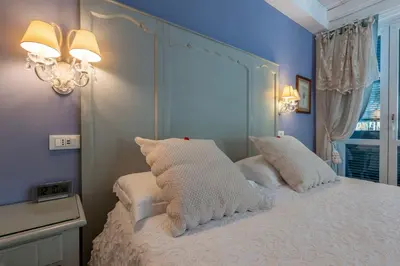 Letto o letti in una camera di Villa Valentina