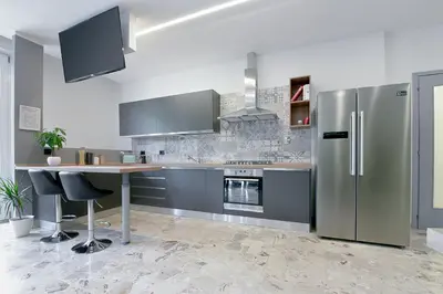 Cucina o angolo cottura di Alle Porte Del Centro - Guest House - Reggio Emilia - Ingresso Centro Storico - Parcheggio Gratuito