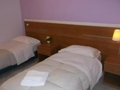 Letto o letti in una camera di Albergo Meublè Abatjour