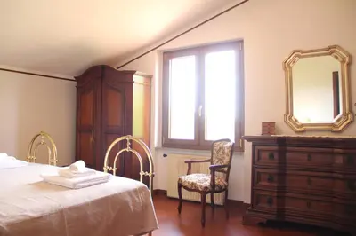 Letto o letti in una camera di Villa Veralda, la magia di una Toscana insolita