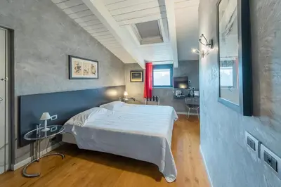 Letto o letti in una camera di Century Hotel