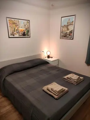 Letto o letti in una camera di casa in oltretorrente Parma