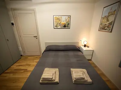 Letto o letti in una camera di casa in oltretorrente Parma
