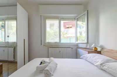 Letto o letti in una camera di JOIVY Banfi Apartment