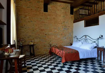 Letto o letti in una camera di Antico Borgo Di Tabiano Castello - Relais de Charme