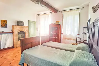 Letto o letti in una camera di B&B Due Fiumi 1908