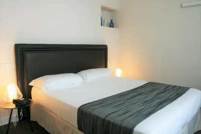 Letto o letti in una camera di Hotel Palazzo Vannoni