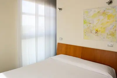 Letto o letti in una camera di Vista Hotel & Residence