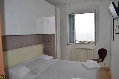 Letto o letti in una camera di Hotel San Pietro Chiavari