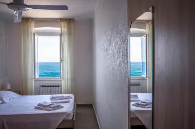 Letto o letti in una camera di Hotel San Pietro Chiavari