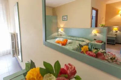 Letto o letti in una camera di Hotel Sporting