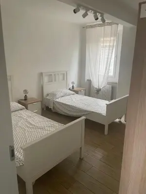 Letto o letti in una camera di Al Battistero