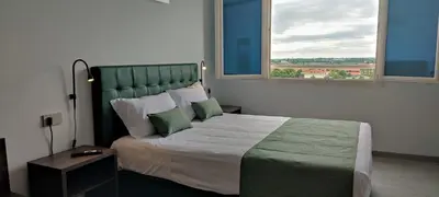 Letto o letti in una camera di Suites Direzionale Carpi