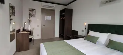 Letto o letti in una camera di Suites Direzionale Carpi