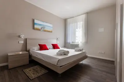 Letto o letti in una camera di Sant'agnese apartment - Smart Holiday