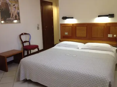 Letto o letti in una camera di Albergo Bianchi Stazione