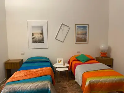 Letto o letti in una camera di LA MOTOCICLETTA
