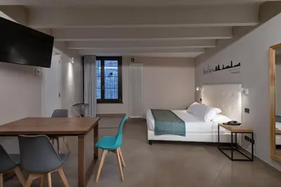 Letto o letti in una camera di Bonacolsi Collection, MantegnaHotels