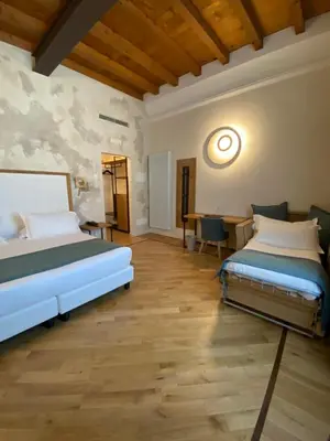 Letto o letti in una camera di Cà Uberti Home Boutique, MantegnaHotels