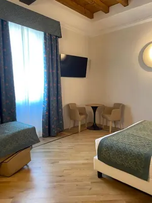 Letto o letti in una camera di Cà Uberti Home Boutique, MantegnaHotels