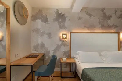 Letto o letti in una camera di Cà Uberti Palace Hotel, MantegnaHotels
