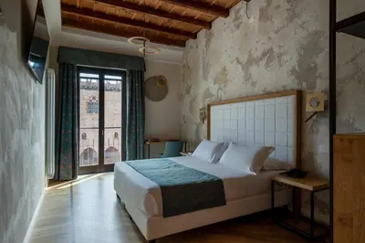 Letto o letti in una camera di Cà Uberti Palace Hotel, MantegnaHotels
