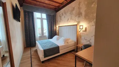 Letto o letti in una camera di Cà Uberti Palace Hotel, MantegnaHotels