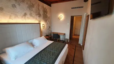 Letto o letti in una camera di Cà Uberti Palace Hotel, MantegnaHotels