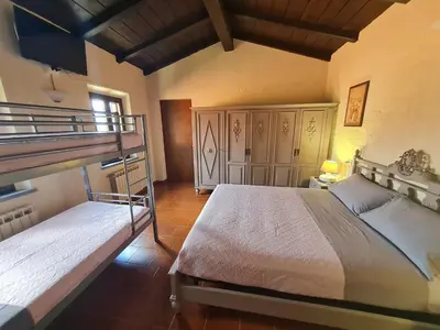 Letto o letti in una camera di DA ERCOLE casa vacanze di lusso con giardino, piscina e idromassaggio.
