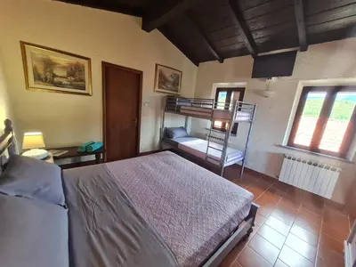 Letto o letti in una camera di DA ERCOLE casa vacanze di lusso con giardino, piscina e idromassaggio.