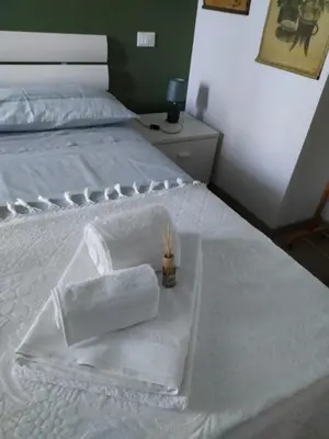 Letto o letti in una camera di Casa Vacanze I Giardini di Marzo