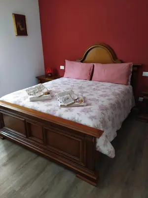 Letto o letti in una camera di Casa Vacanze I Giardini di Marzo