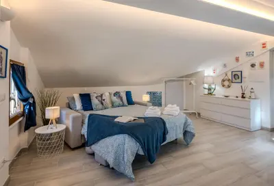 Letto o letti in una camera di Mansarda al mare